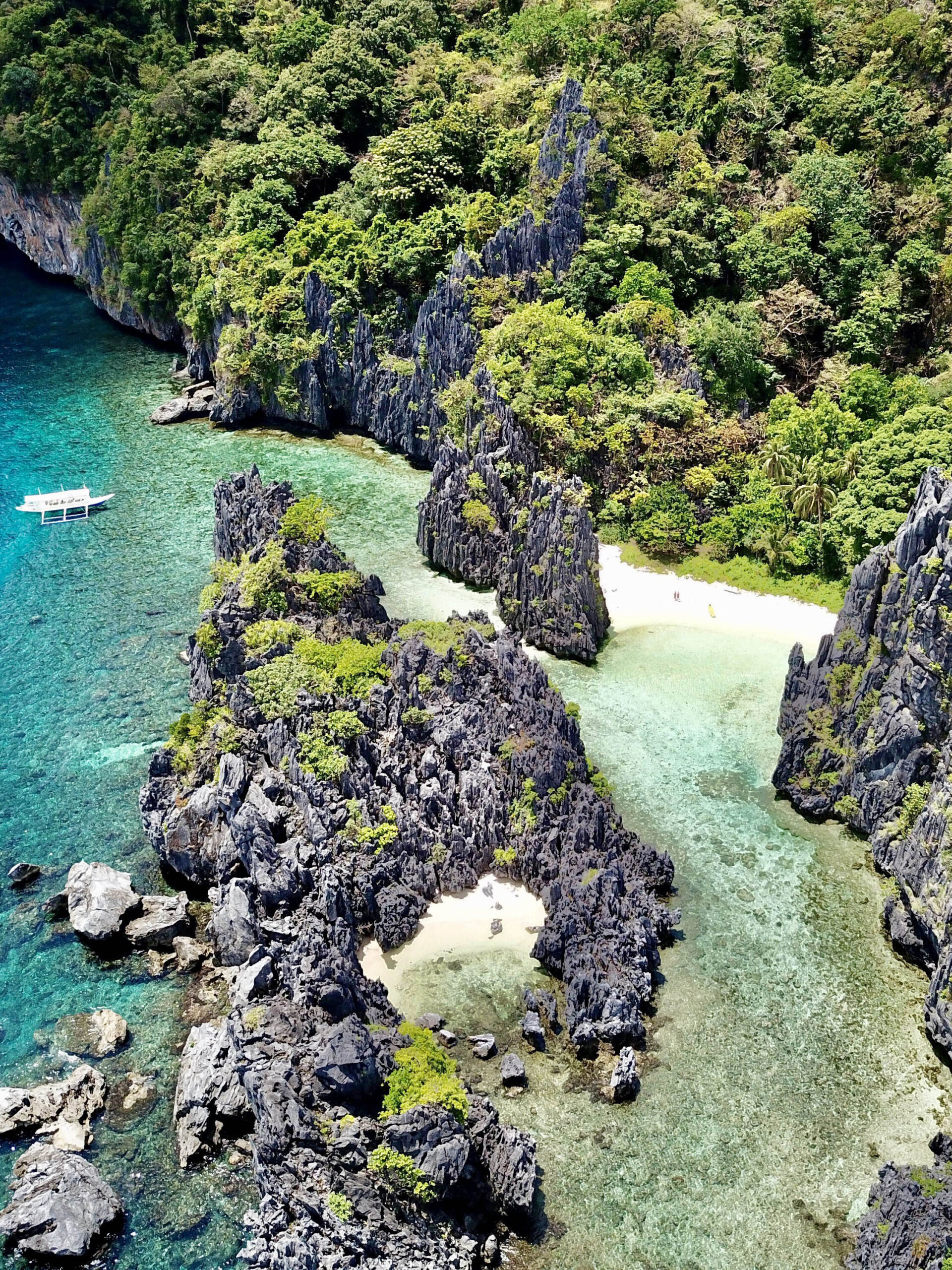 Hidden Beach cove surrounded by limestone cliffs on El Nido Tour C