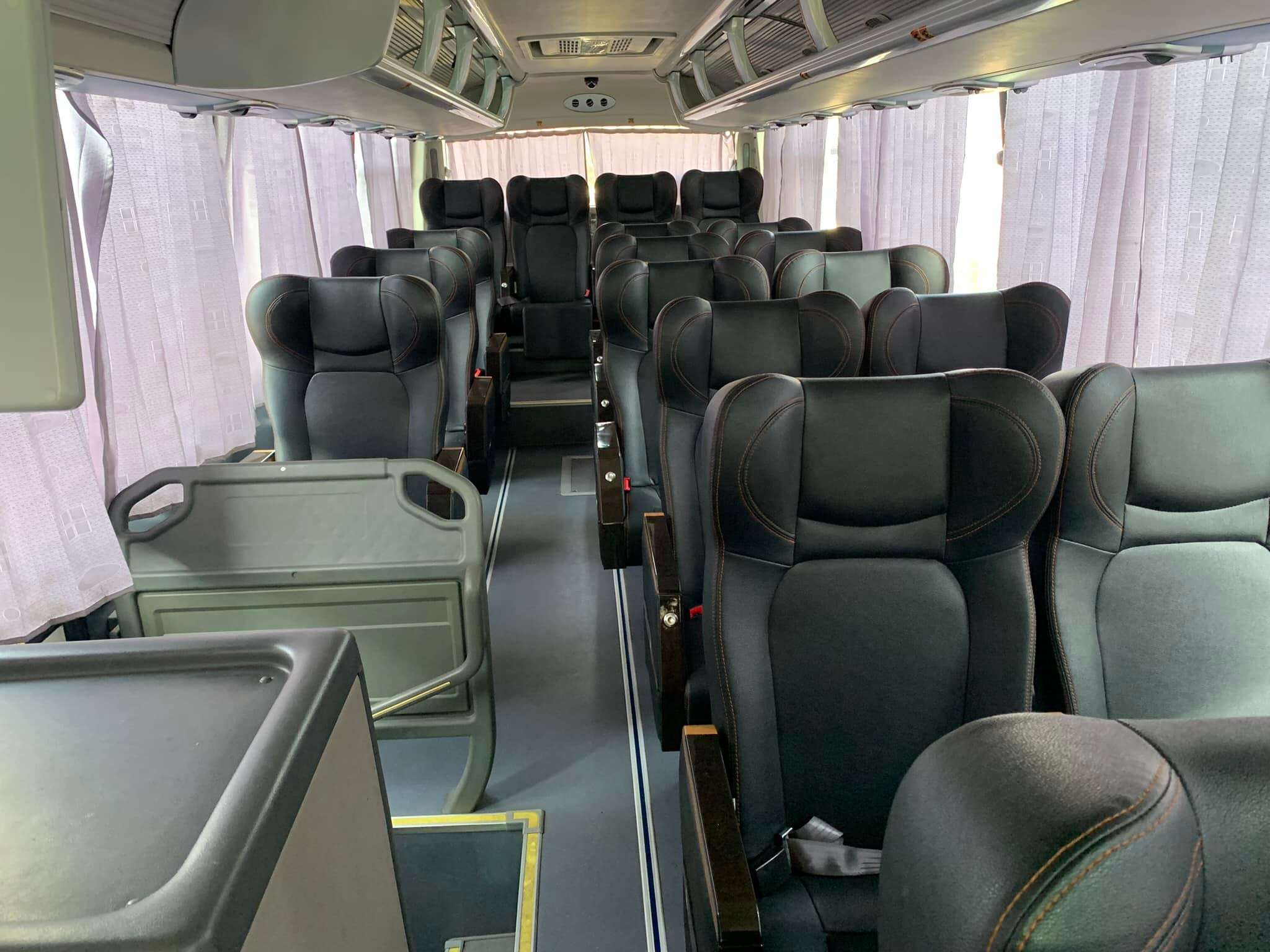 Comfortable reclining seats inside a Cherry Bus coach traveling between Puerto Princesa and El Nido, Palawan.