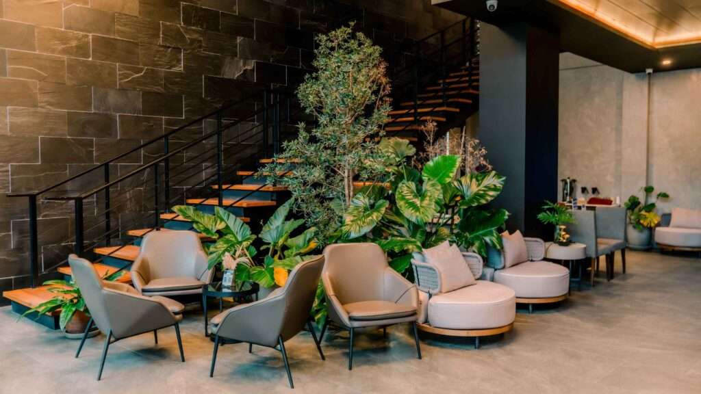 High-ceilinged lobby at H Hotel El Nido with tropical planting