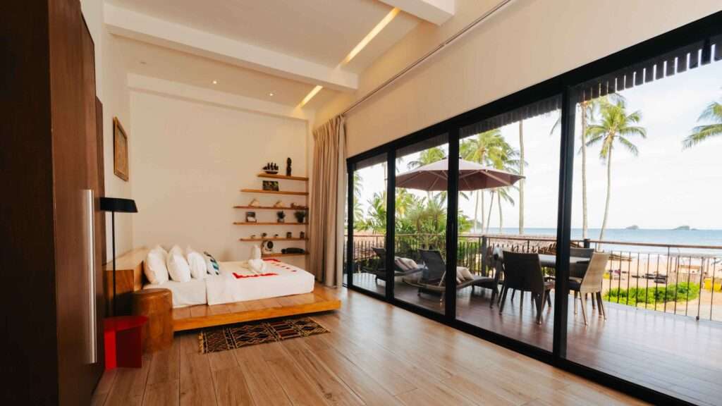 Bedroom in an Executive Beach Front Villa at Nacpan Beach Villas opening onto a terrace and the sea