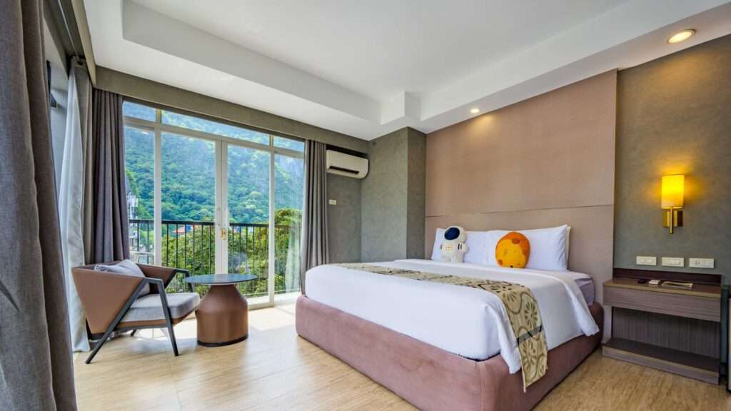 Deluxe King room with Mountain View at S Resort El Nido looking out to the limestone cliffs